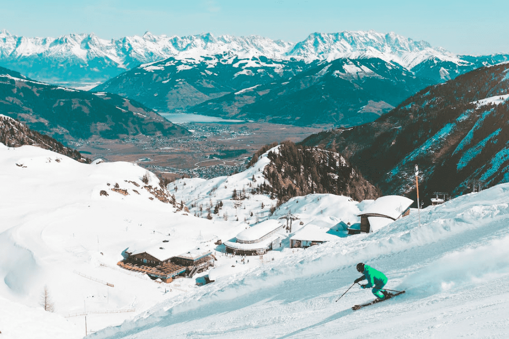 Man skiing down an empty mountain during shoulder season