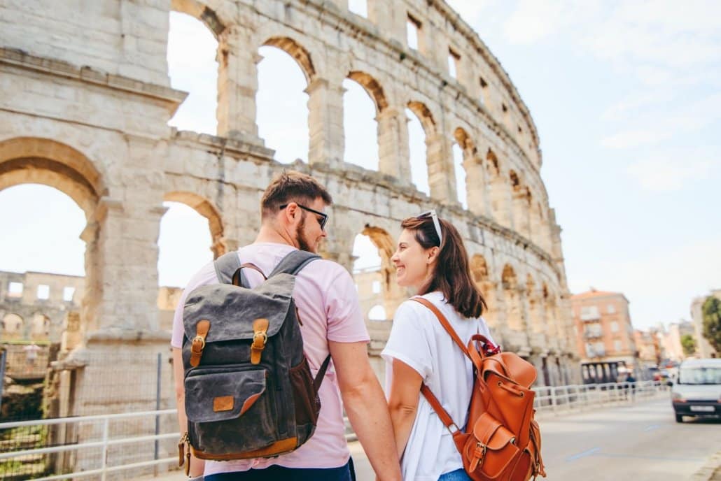 Couple enjoying a view of the colosseum during a quieter visit 