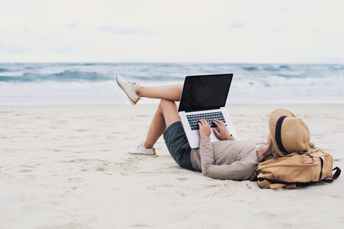 Digital nomad working from the beach