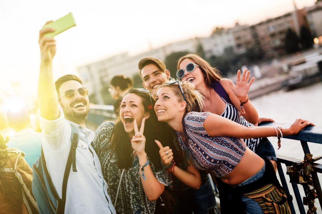 Group taking a selfie by a river