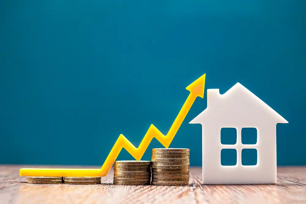 coins, arrow graph, and house model